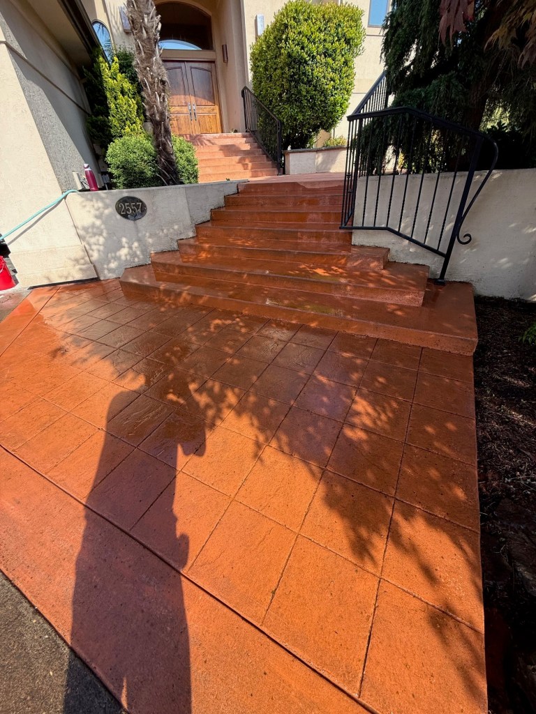 Stamped concrete entry cleaned with high-flow